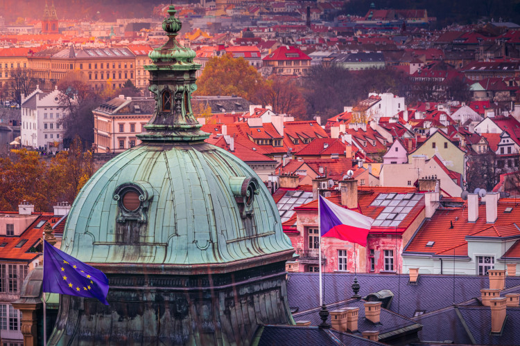 above-prague-panorama-with-euro-and-czech-flag-at-sunset--czech-republic.jpg