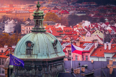 above-prague-panorama-with-euro-and-czech-flag-at-sunset--czech-republic.jpg