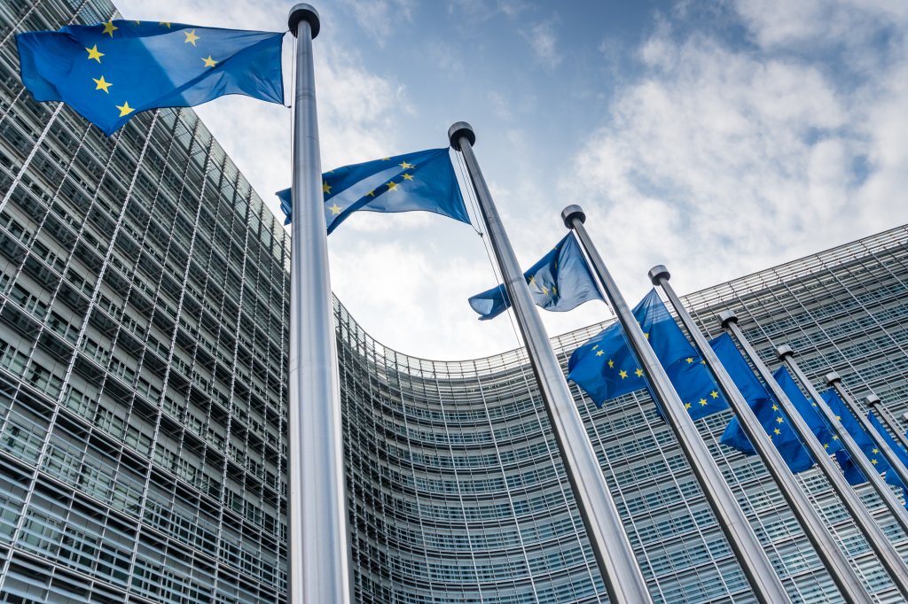 European Union flags waiving at Berlaymont building of the European Commission in Brussels, Belgium.